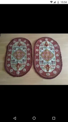 Tapetes bordados à mão