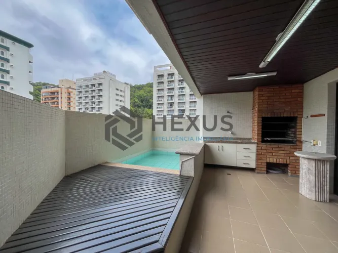 Apartamento com piscina e churrasqueira na varanda na Praia das Pitangueiras, Guaruja