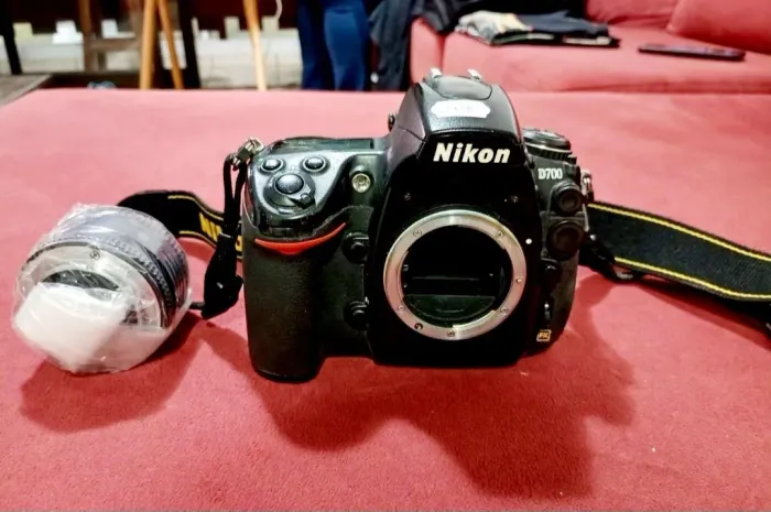 Maquina nikon,lente 100% máquina tem que trocar as borrachas