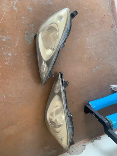 Par de farol Honda Fit 2009 original.
