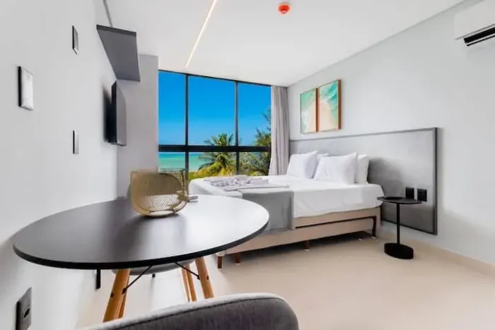 Vendo belíssimo flat frente mar e pé na areia tomo mobiliado.