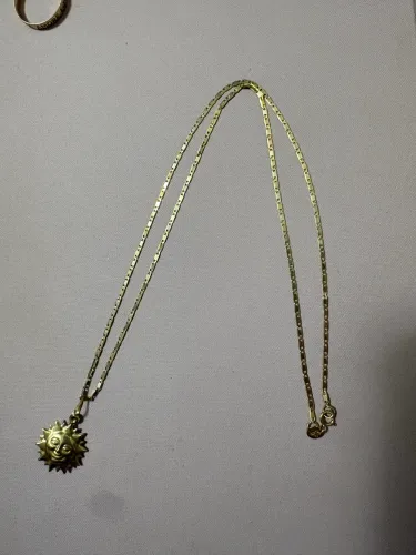 Cordão de ouro e anel de ouro