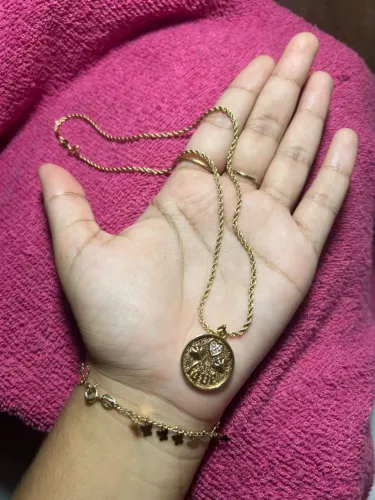 vendo um cordão com pingente da magold 