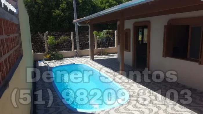 Casa c/ piscina em Capão da Canoa, 2 quartos, 2 vagas garagem