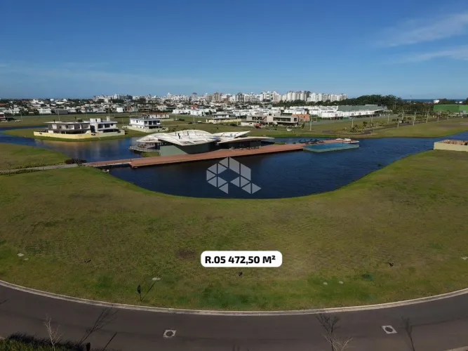 Terreno a Beira Lago no condomínio Lotus em Atlântida - Xangri-lá