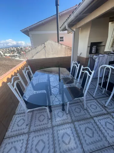 Mesa de vidro com base de ferro c/4cadeiras usada