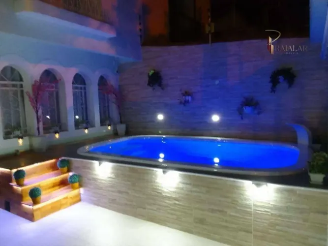Casa em Praia Grande com 3 Dormitórios e Piscina no Boqueirão