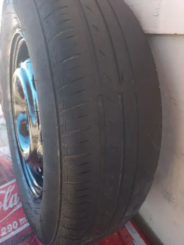Vendo aro e pneu meia vida aro do celta original..175/75