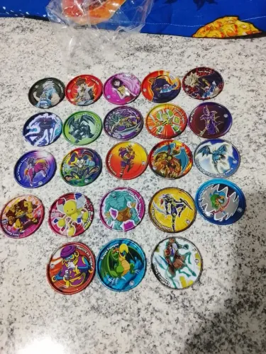 23 tazos yo gi oh metais sem repetir.