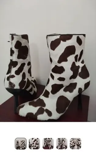 bota couro bovino num35 180,00<br>salto 10cm<br>estado de nova