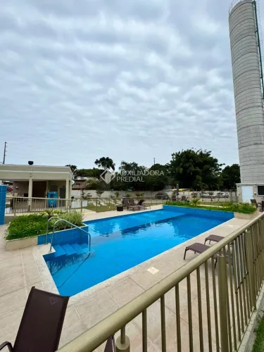 Apartamento de dois dormitórios com sacada e churrasqueira