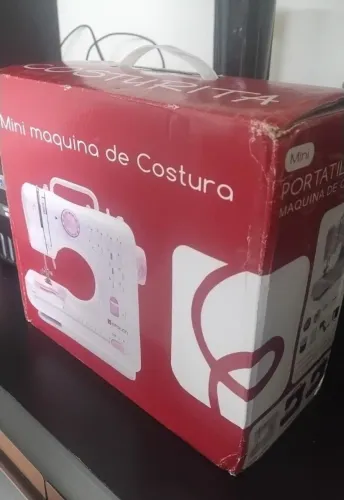 Máquina de costura nova na caixa 200,00