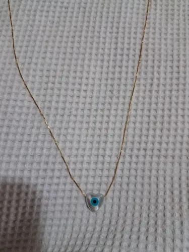 Vendo gargantilha  com banho de ouro 24lk com 48cm com olho grego em forma de coração 