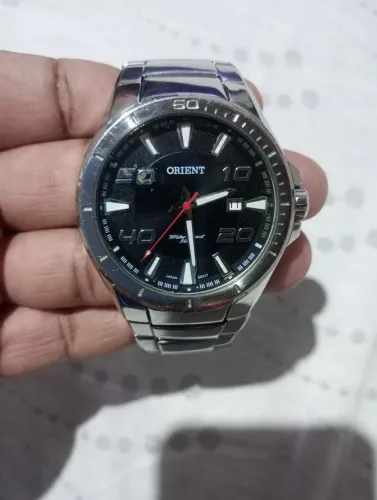 Vendo relógio Orient original por R$370,00.