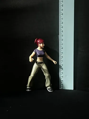Boneca miniatura April dos filme Mutantes Ninjas ano 2003