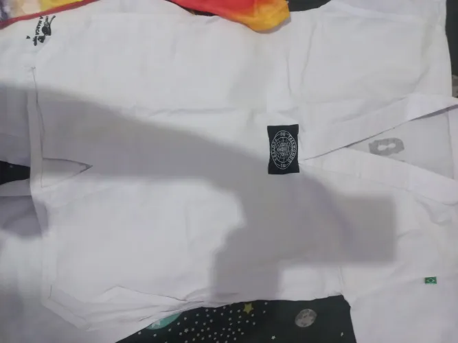 Roupa de luta Taekwondo. Para menino de oito anos.
