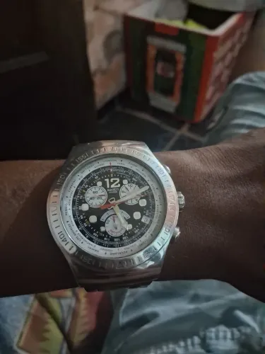 relógio swotch zeri prata zero dando 360 chama *52