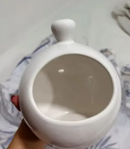 Vendo porta alho de porcelana novo