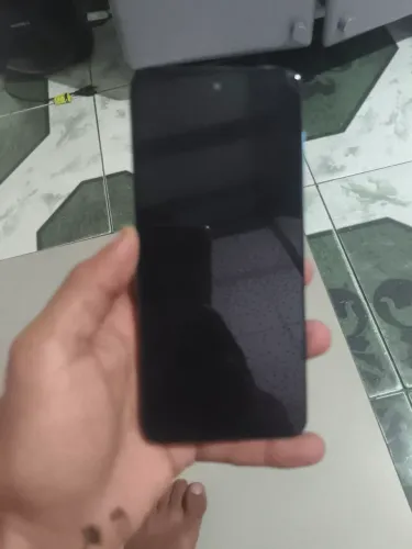 Celular moto g 22 128 GB com carregador original e a caixa dele tenho a nota
