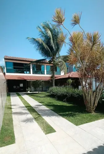 Casa de praia em Vila Velha com ar condicionado piscina churrasqueira área de jogos .