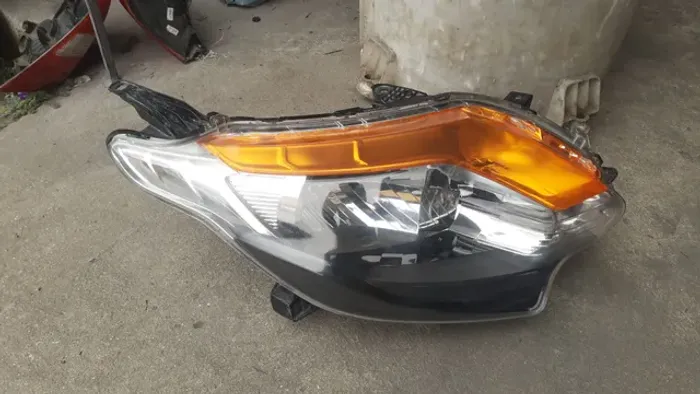 Farol da L200 Triton Sport