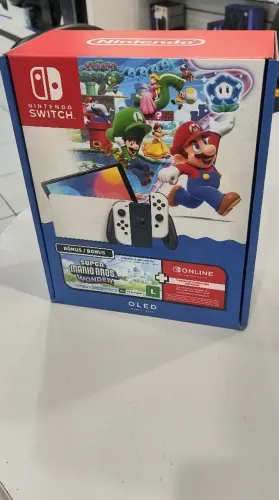 Nintendo switch OLED zero, com jogo Mário Wonder mídia digital e assinatura da Nintendo.