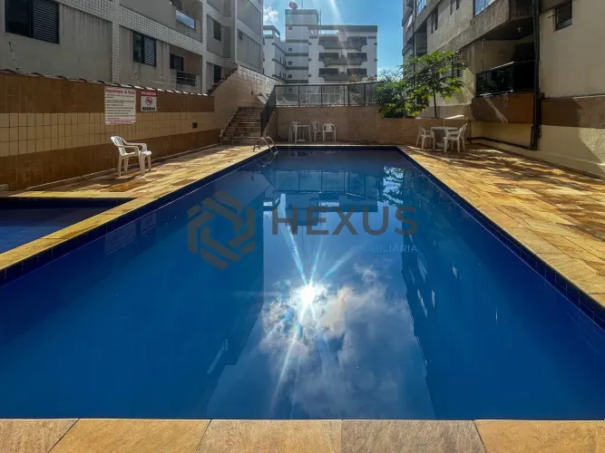 Apartamento com varanda e lazer a 600m da praia no Tombo, Guarujá