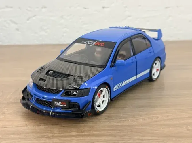 Miniatura Mitsubishi Lancer Evolution IX 1:24 azul - som e luz 