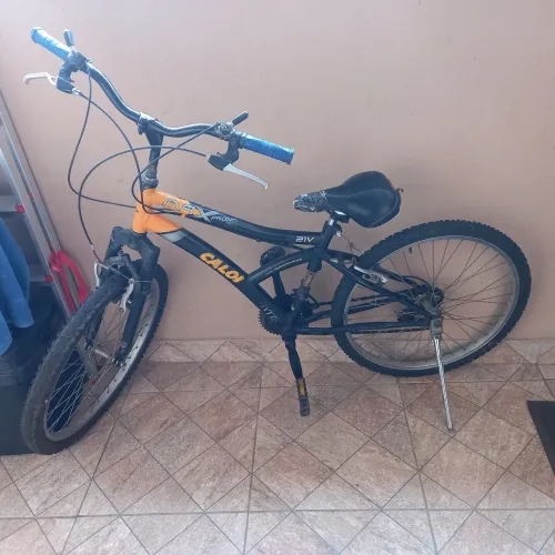 Vendo bicicleta em ótimo estado da marca calor com macha,ARO 26.