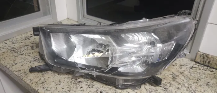 Farol Original Hilux SRV 2021 em diante