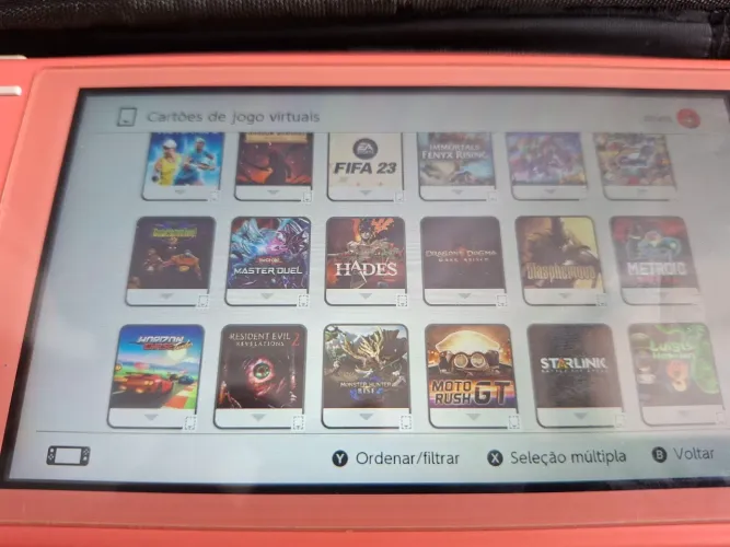 Nintendo Switch Lite Coral com jogos
