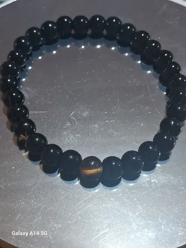 Pulseira de ônibus com 1 bolinha de Olho de Tigre. Cristais naturais.