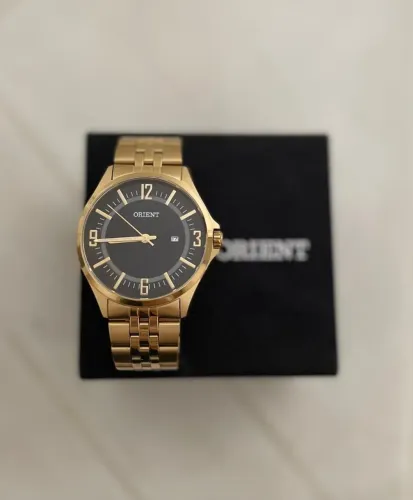 Relógio Orient masculino dourado 