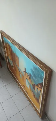 Tela pintada a mão em quadro moldurado, medindo 1,40 comprimento X 0,90 altura