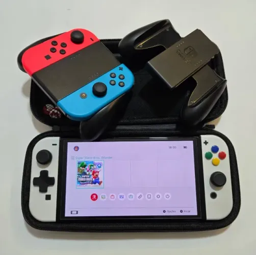 Nintendo Switch OLED + Joycon extra + cartão de memória + acessórios