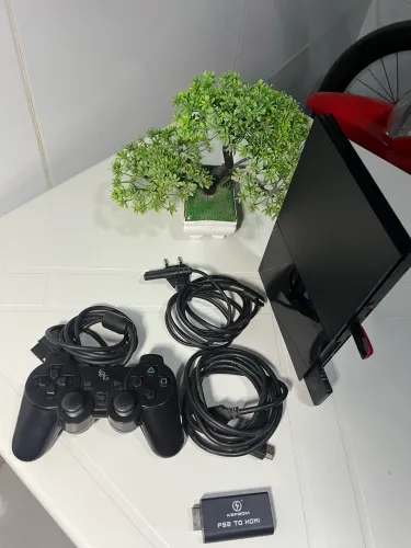 Ps2 Slim conservadíssimo , e com jogos 