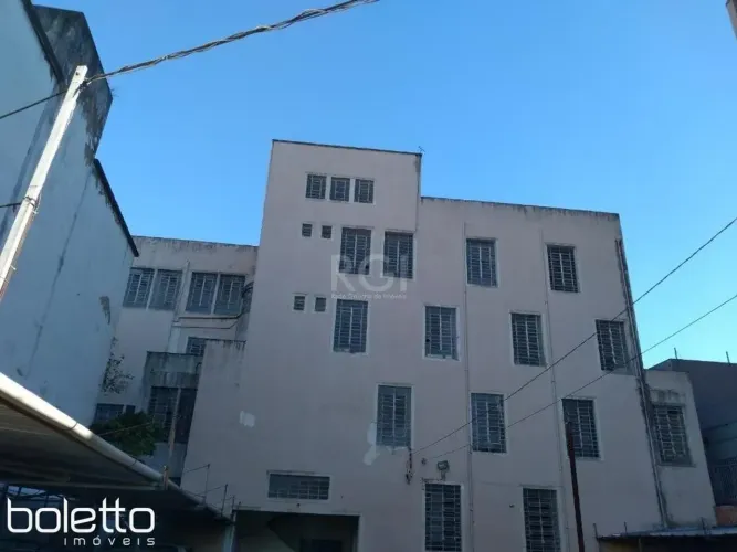 Prédio comercial para locação, estacionamento, Bairro São Geraldo, Porto Alegre.