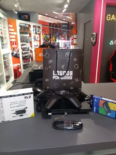PS2 com garantia e vários jogos!
