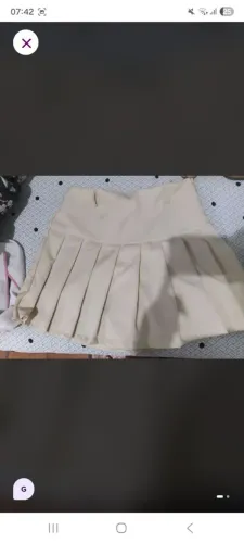 Short saia plissada