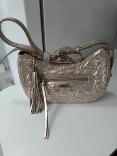 Bolsa dourada schutz média Mirella couro