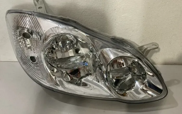 FAROL PRINCIPAL TOYOTA COROLLA 2003/2004 4 PORTAS MANUAL CROMADO DIREITO