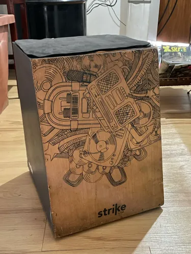 Cajón Strike pra vender logo