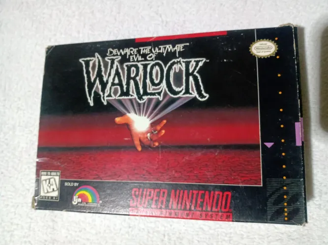 Jogo Warlock com caixa e manual tudo original. Pra Super Nintendo.