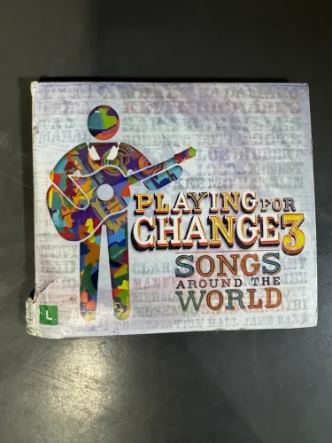 Álbum Playing for Change 3: Songs Around the World, lançado em 2014 (CD e DVD)