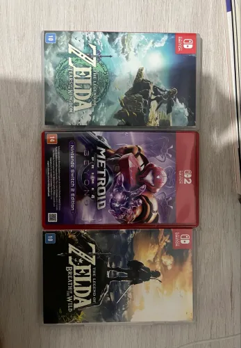 Jogos de switch: Zelda Breath of the wild, Tears of the kingdom e Metroid prime 4.