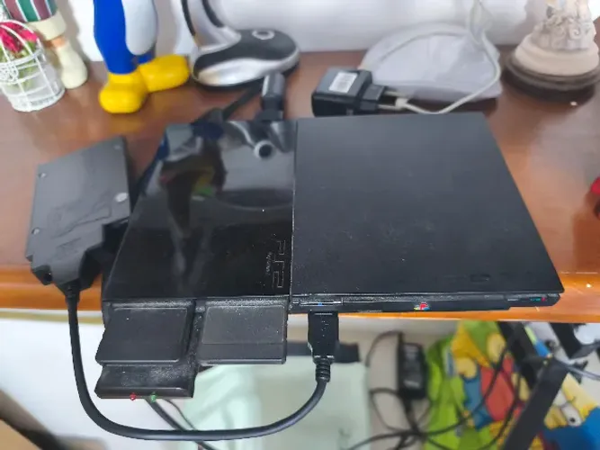 Ps2 com acessórios (leitor não funciona)
