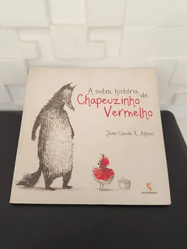 Livro " A outra história de chapéu Zinho vermelho"
