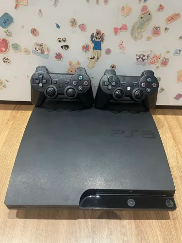 PS3 Slim 2 controles com vários jogos