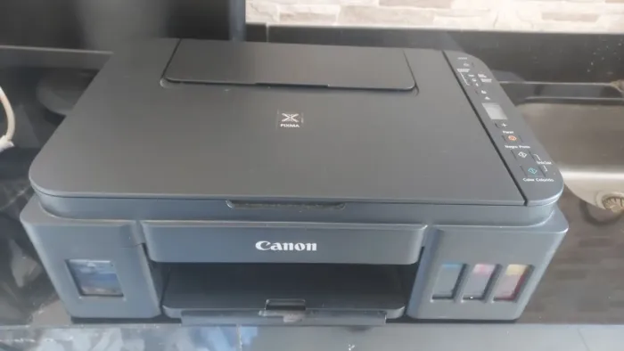 Impressora canon tanque,multifuncional ,   com pequeno desfeito 
