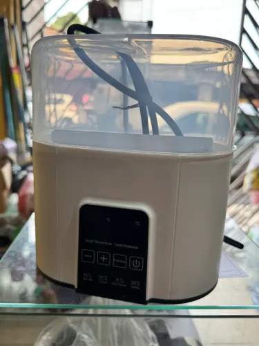 Aquecedor e esterilizador de mamadeiras